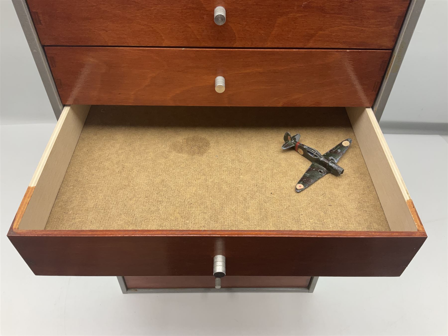 Tabletop chest with nine drawers, with Dinky toy and other die-cast model parts, drawers H62cm