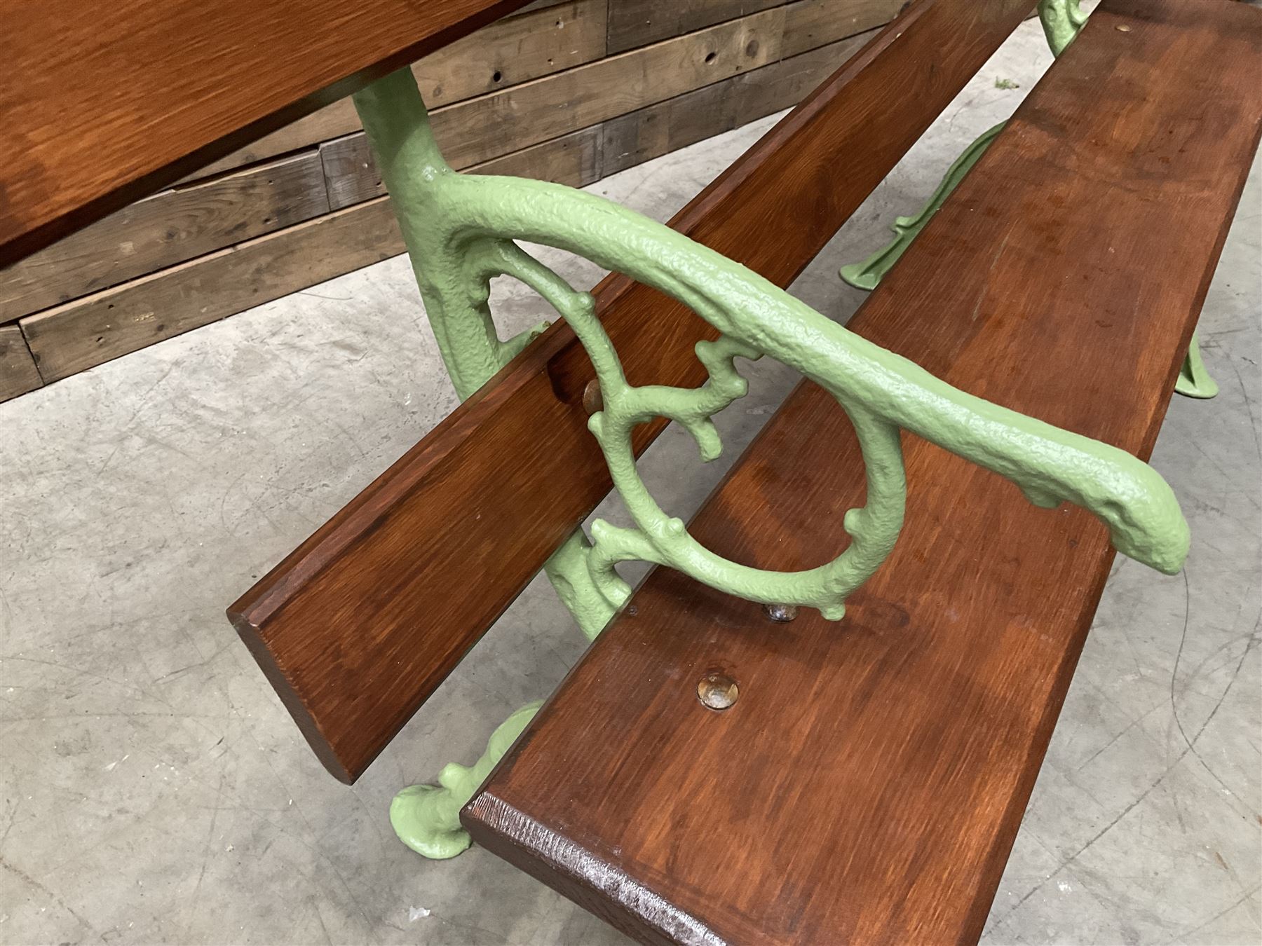 Cast iron and wood slate bench painted in green