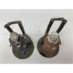 Pair of late 19th century, early 20th century  Folk Art nodding figures, modelled as a seated elderly lady and gentleman each seated on a wooden chair, H17cm