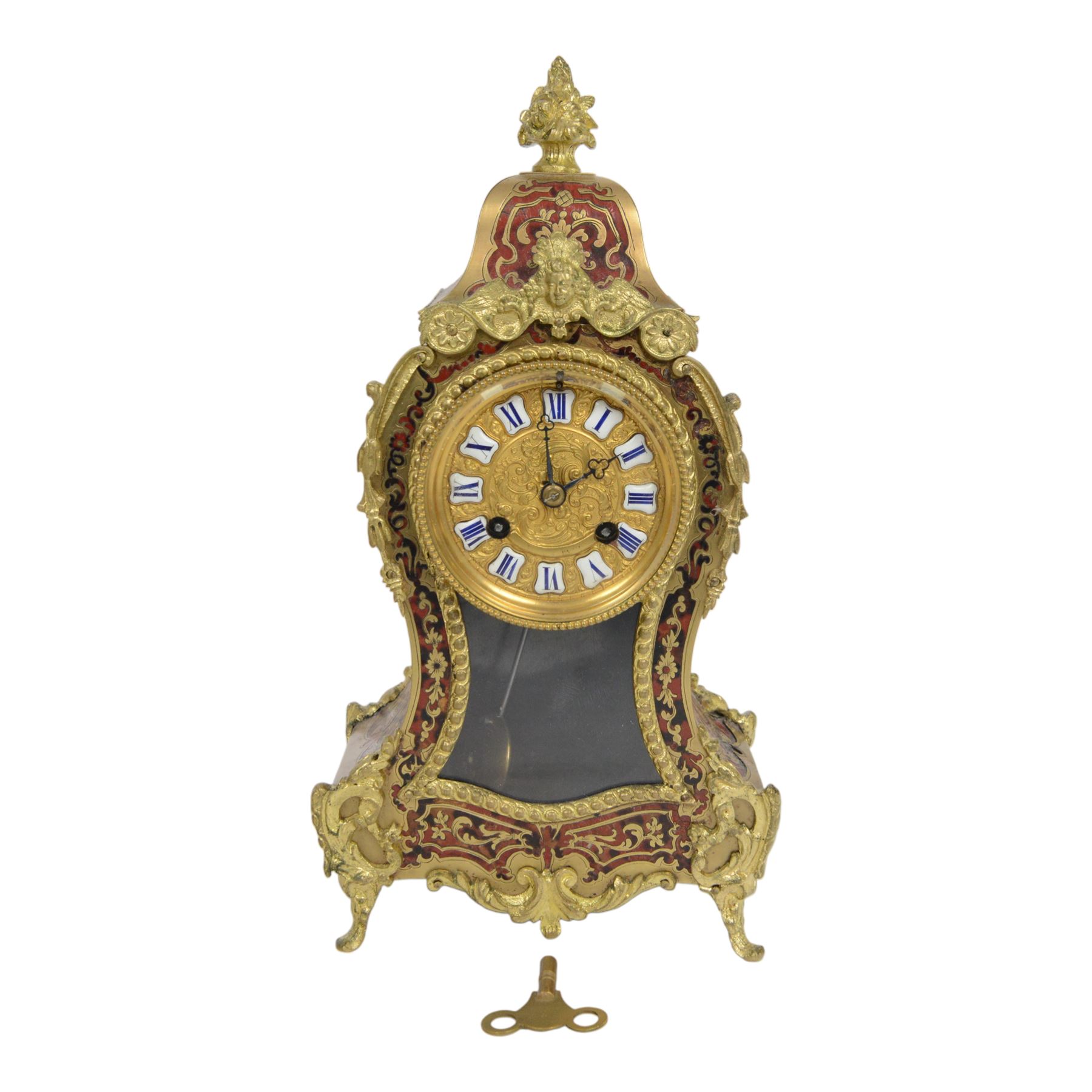 Louis XV-style gilt-bronze mounted turtleshell boulle mantel clock, the case of typical waisted form, gilt bronze foliate scroll and rocaille mounts, raised on scroll feet. Eight-day Paris movement signed “Rollin à Paris”, with outside count-wheel striking half-hourly on a single bell, the going train with anchor escapement. The circular foliate gilt bronze dial with enamelled Roman hour numerals and twin winding apertures, fitted with pierced blue steel hands and bevelled glass cover, with pendulum and key, circa 1860