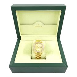 Rolex Oyster Perpetual Day-Date gentleman's 18ct gold automatic wristwatch, circa 1970, Ref. 1803, serial No. 2492514, champagne dial with after market diamond dot hour markers and diamond set bezel, on 18ct gold President bracelet, with fold-over clasp, boxed