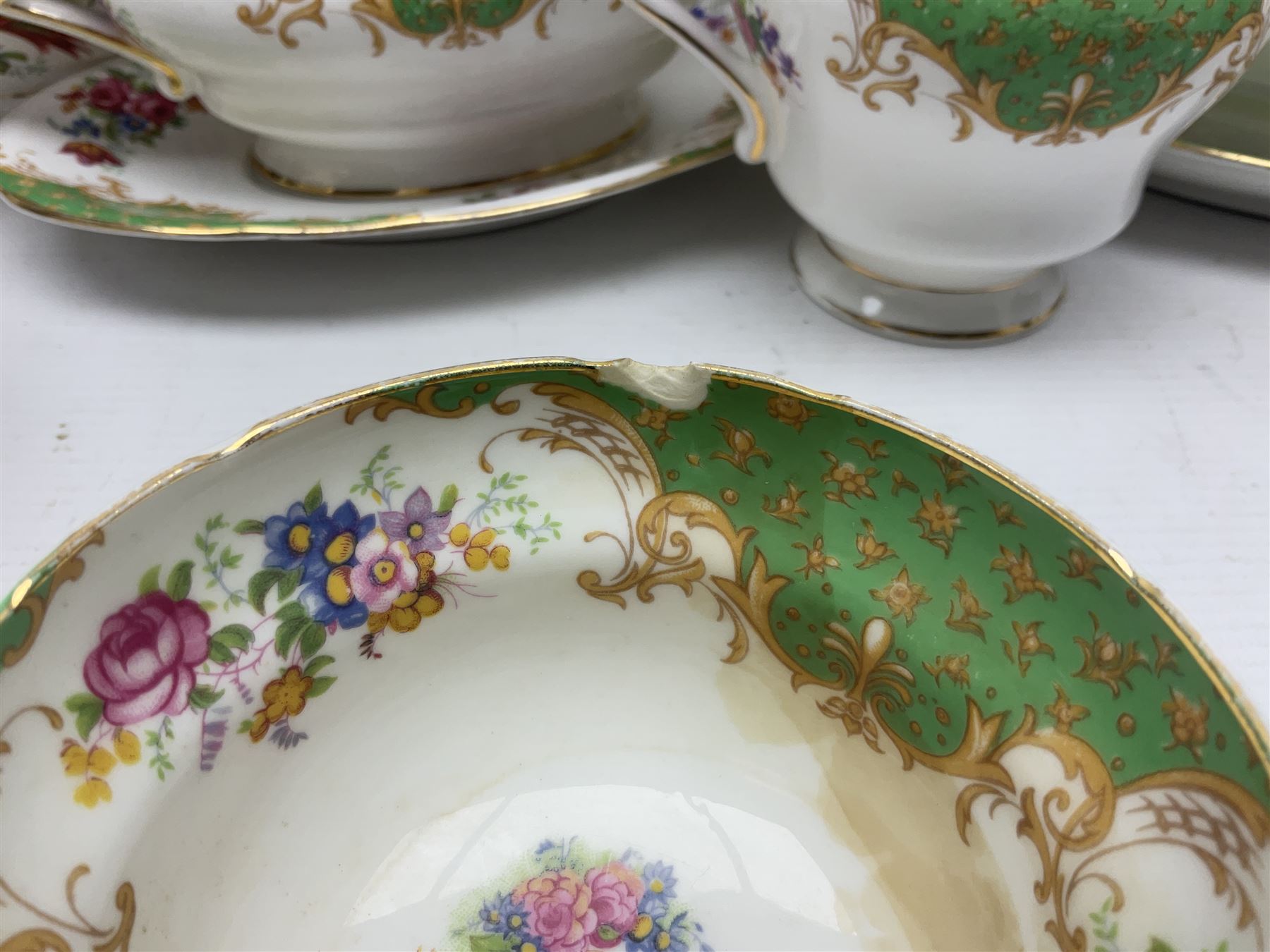 Paragon Rockingham pattern part tea and dinner service including three teapots, milk jug, cups and saucers of various sizes, ten soup bowls, ten side plates, ten dinner plates etc (96)