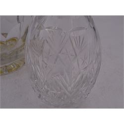 Two modern silver mounted decanters, the first example with etched and cut fruiting vine decoration to glass body, with faceted stopper, hallmarked C J Vander Ltd, Birmingham 1980, the second smaller example, with oval cut decoration and flambe type stopper, hallmarked S J Rose & Son, Birmingham 1985, tallest H28.5cm