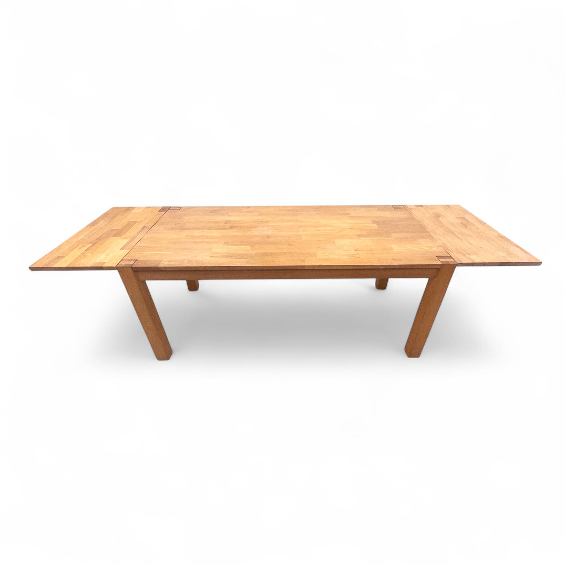 Contemporary solid oak rectangular dining table, with two additional extension leaves, together with eight matching high back dining chairs upholstered in cream suede-effect fabric (9) (Chair H 95cm, W 41cm, D 53cm) (Extends to 270cm)