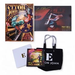 Elton John Farewell Yellow Brick Road tour merchandise, comprising programme, tote bag and VIP giftset with lanyard, wallet, luggage tag and keyring, in white box with gilt lettering, together with two limited edition Farewell Yellow Brick Road lithographs