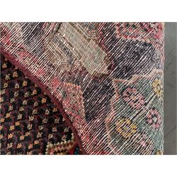 Persian Hamadan blue ground rug, medallion on field decorated with repeating motifs, the guarded border with multiple medallions decorated with flower heads and stylised motifs