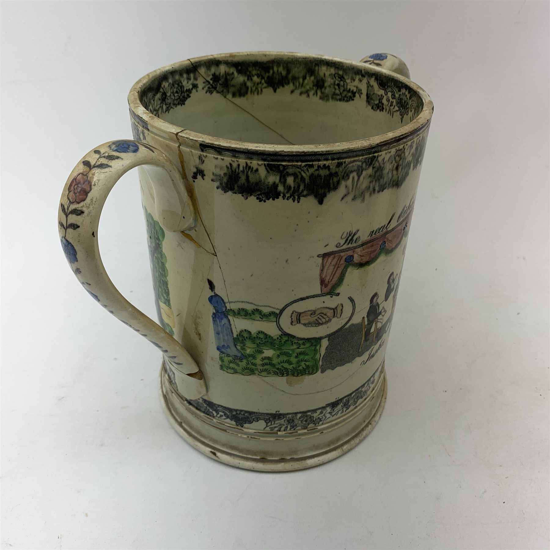 A large 19th century Staffordshire loving cup, detailed 'The Real Cabinet of Friendship Justice and Equity' (a/f), H22cm, together with a pair of 19th century Staffordshire dalmatians, upon oval blue bases, H13cm, a Dresden ewer hand painted with floral sprays, with mark beneath, H15.5cm, and a Coalbrookdale style floral encrusted vase and cover, H16.5cm. 