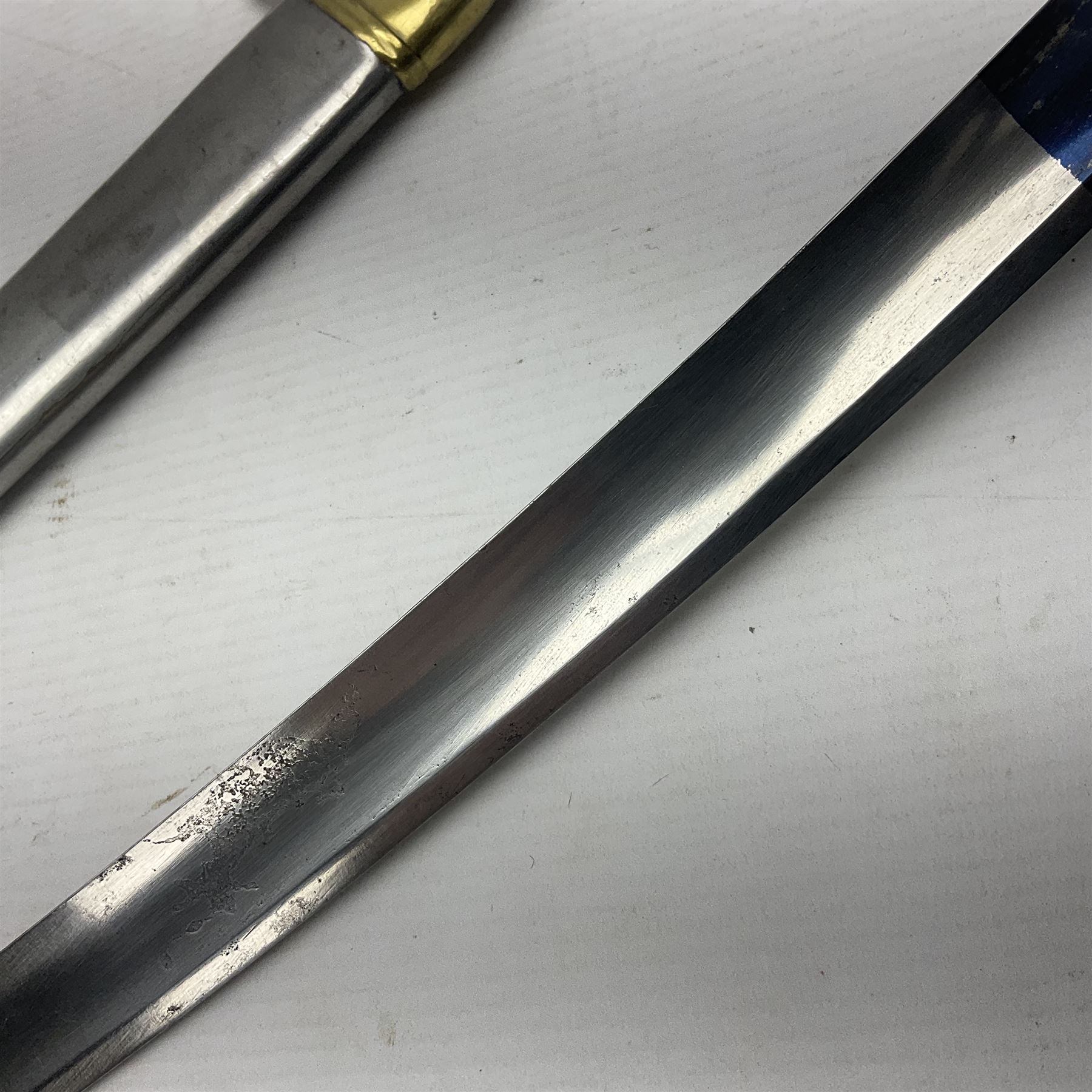 Early 19th century French Lancers officer's sword c1810, the 84cm curving fullered blade retaining most of its bluing, gilding and engraved decoration, inscribed I.S.& C. to ricasso (for Schimelbusch), brass three-bar hilt with elongated elliptical langets and wire-bound leather grip; in polished steel scabbard with two brass suspension rings L100cm overall