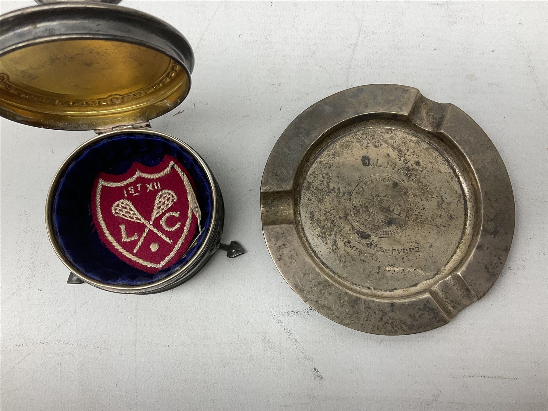 Two early 20th century silver trumpet vases to include a Martin Hall & Co Ltd example, silver circular box raised on three feet stamped Birmingham 1912, ashtray hallmarked London 1945, silver backed hair brush with engine turned decoration etc, tallest H19.5cm