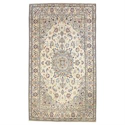 Central Persian Nain hand-knotted silk and wool rug, ivory field with a cusped medallion  ...