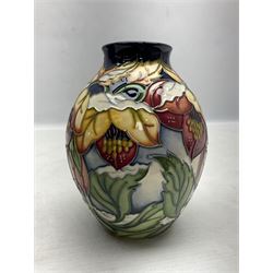 Moorcroft vase decorated in Christmas Hellebore pattern, designed by Rachel Bishop, with impressed and painted marks beneath, in original box,  H14cm