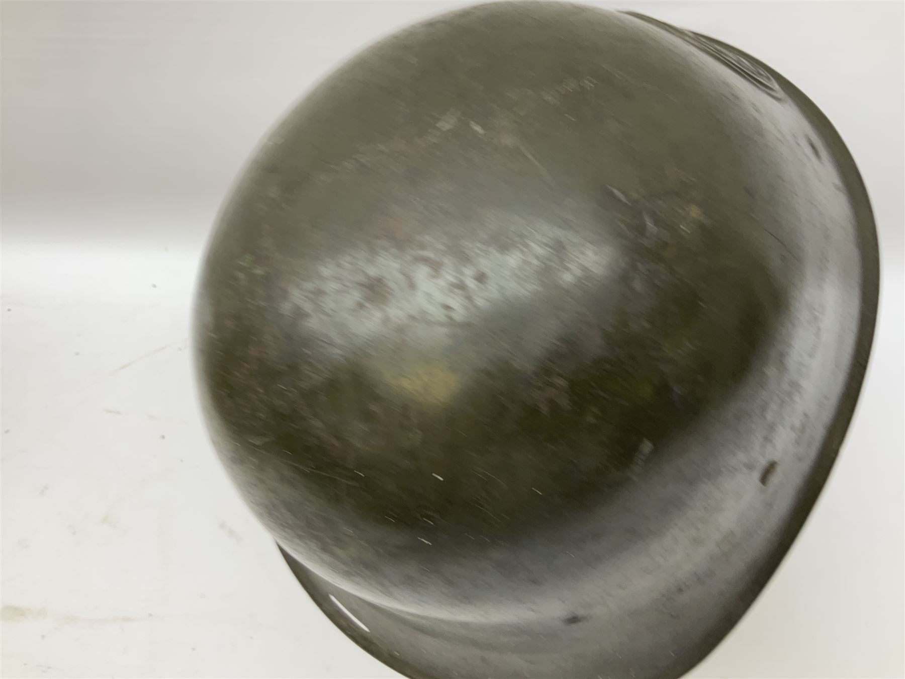 WW2 French M-26 Adrian Pattern Steel Helmet, original olive drab paint finish; flaming grenade badge to the front signifying issue to an Infantry regiment; original leather liner and leather chinstrap; and WW2 Dutch steel helmet with liner and chin strap (2)