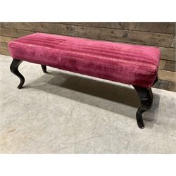 Large rectangular footstool upholstered in a maroon fabric with cabriole supports