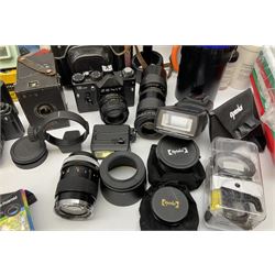 Vintage and later cameras, lenses, accessories and darkroom equipment including Zenit 12XP camera, Praktica BX20 camera fitted with 'Sigma Zoom Master 1:3.5-4.5 f=35-70mm' lens, Praktica LLC camera fitted with 'Carl Zeiss Jena Pancolar 1.8/50' lens, Canon Zoom Lens 'EF 100-300mm 1:5.6', various Jessop and other makers darkroom items including safelight (Red), universal duo tank, multi-mask enlarging easel etc, in three boxes