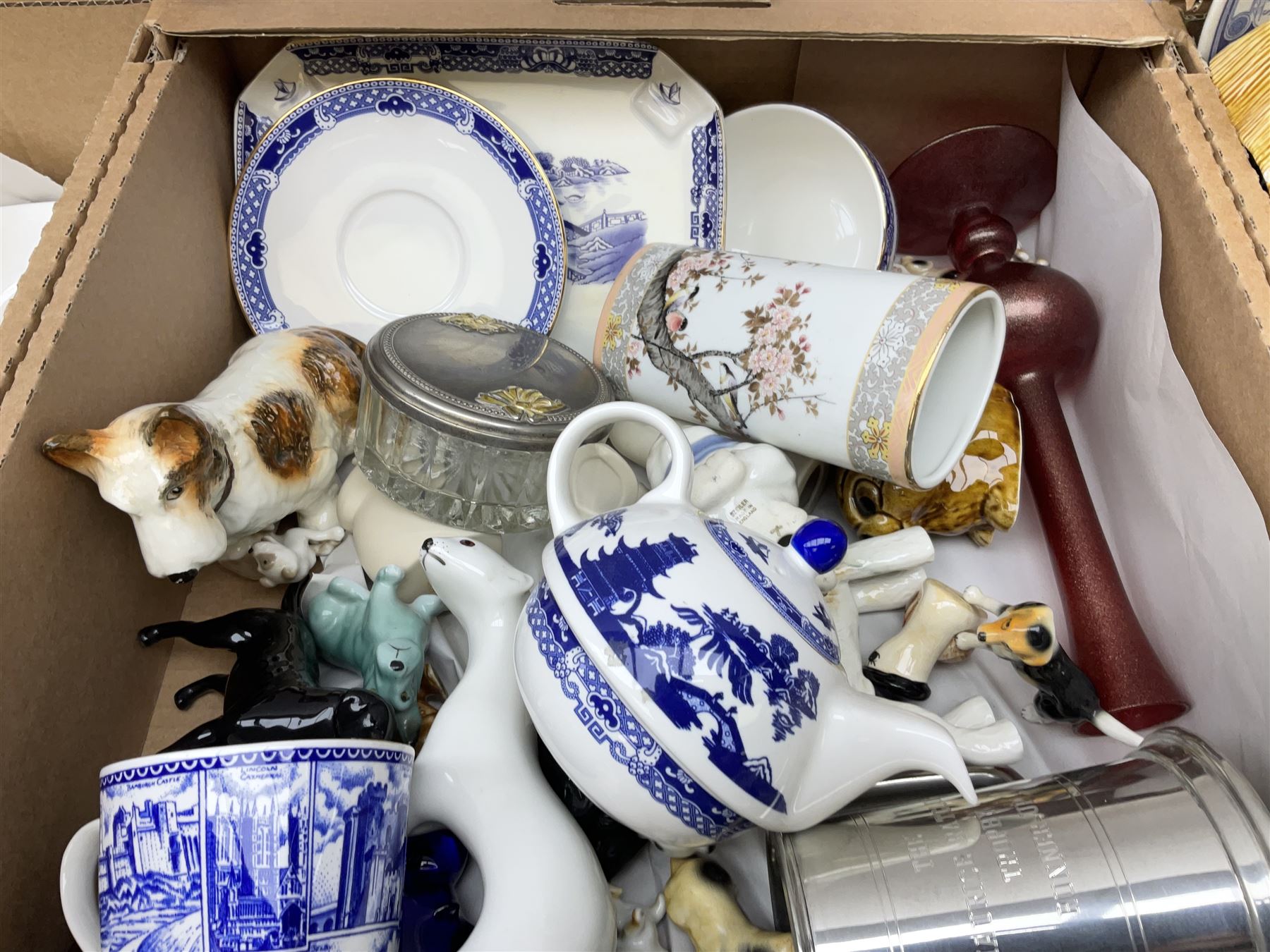 Quantity of various ceramics and glassware to include pair of Disney Mickey and Minnie Mouse cowboy Sherriff figures, stamped Japan beneath, Mason's ironstone, Wedgwood, Portmeirion, tea and dinner wares, collectors plates, glass animals etc in four boxes