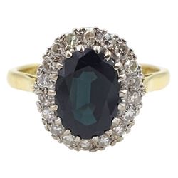 18ct gold oval sapphire and round brilliant cut diamond cluster ring, hallmarked 