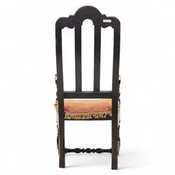 18th century oak provincial armchair, arched and carved cresting rail above triple splat back, shaped arms on turned supports, stuff-over seat upholstered in damask fabric, carved front frieze on turned legs united by stretchers