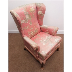  Parker Knoll wingback armchair, upholstered in a pink floral fabric, cabriole feet, W77cm  