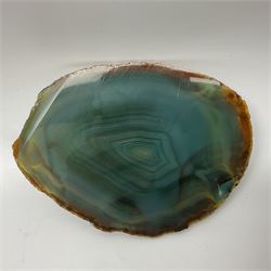 Pair of green agate slices, polished with rough edges raised upon silvered metal stands, H19cm