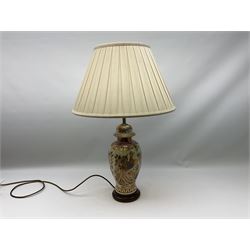 Table lamp of baluster form, decorated in the Oriental style with phoenix and dragon amidst blossoming flowers, with plated cream fabric shade, lamp base not including fixtures H35cm