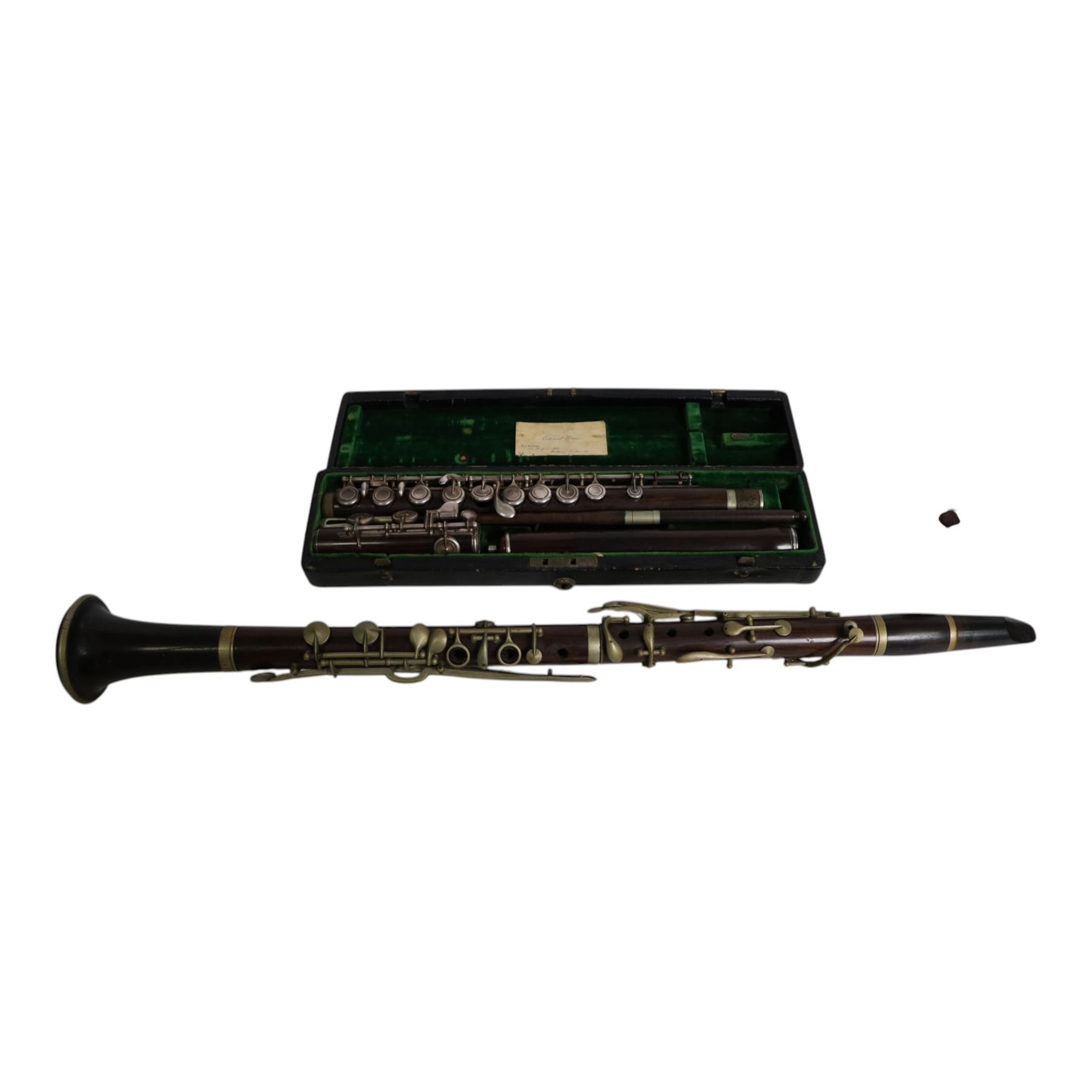 Early 20th century rosewood clarinet by Geo. Potter & Co Aldershot, together with a flute in fitted case, the lid with label reading Edward Potter