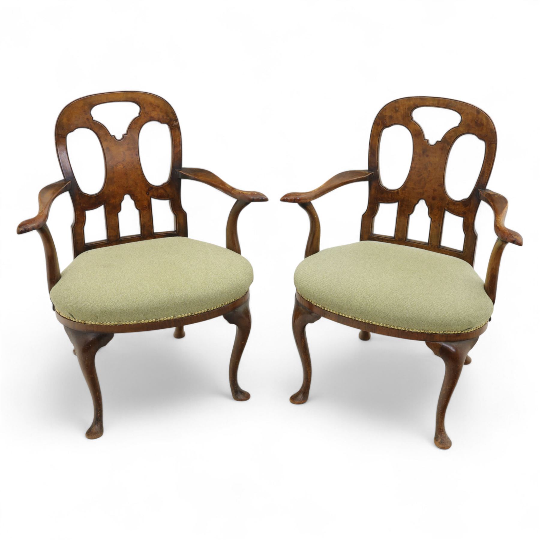 Pair of 1930s Queen Anne design walnut-framed open armchairs with vase-shaped pierced back splat and scroll end arms above a padded serpentine seat, raised on cabriole legs with pad feet