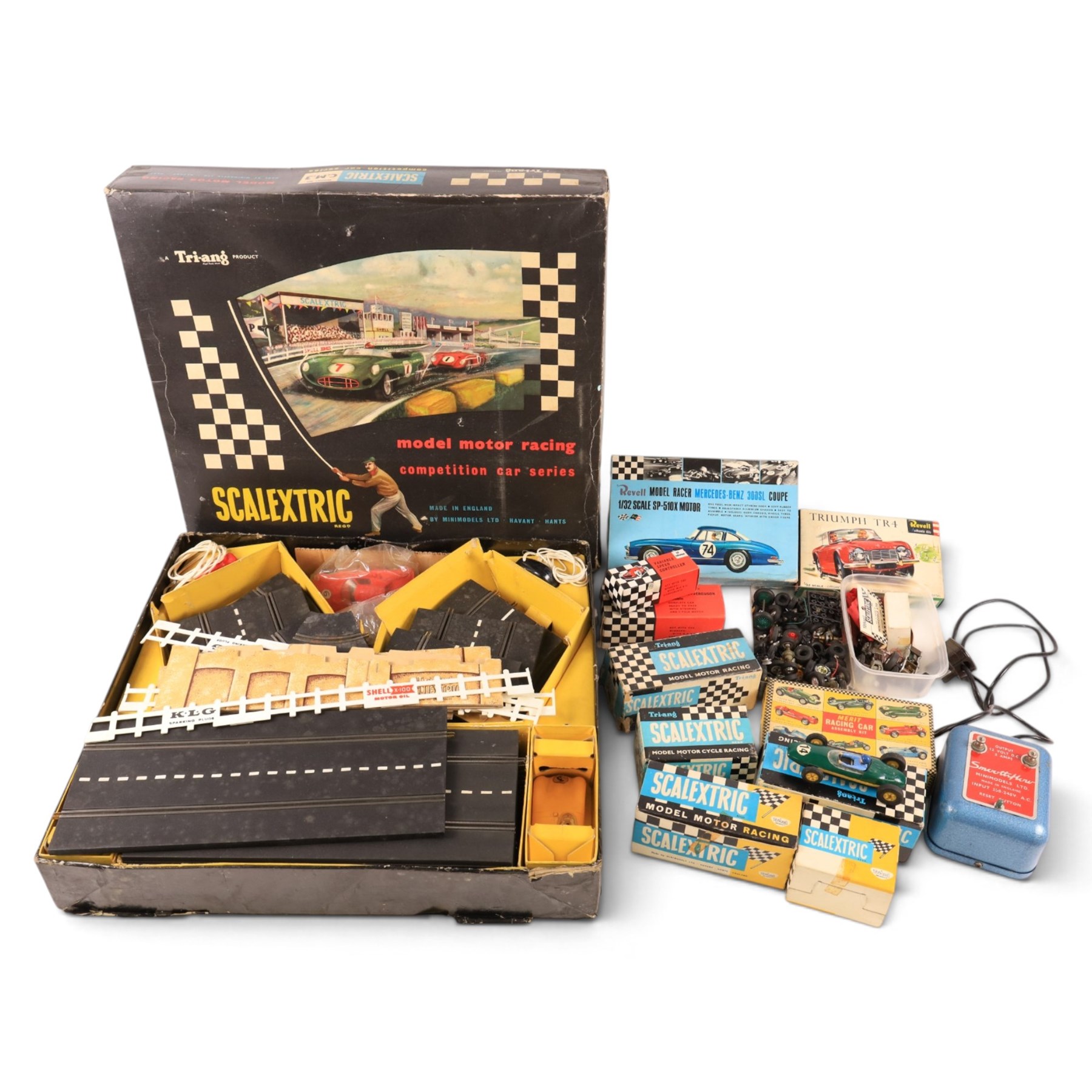 Tri-ang Scalextric Model Motor Racing set C.M.3, with five Tri-ang Scalextric slot car models, including Lotus 1961 in blue, Lotus 1961 in green, Typhoon motorbike and sidecar, B12 Hurricane motorbike and sidecar and Aston Martin DB4 GT,  all boxed, together with Merit Racing Car Assembly Kit, kit built Revell Model Racer Mercedes Benz 300SL Coupe, part built Revell Triumph TR4, Indi-Novi-Ferguson slot car and other accessories 