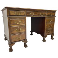 Early 20th century mahogany twin pedestal desk, fitted with nine drawers, on ball and claw carved cabriole feet