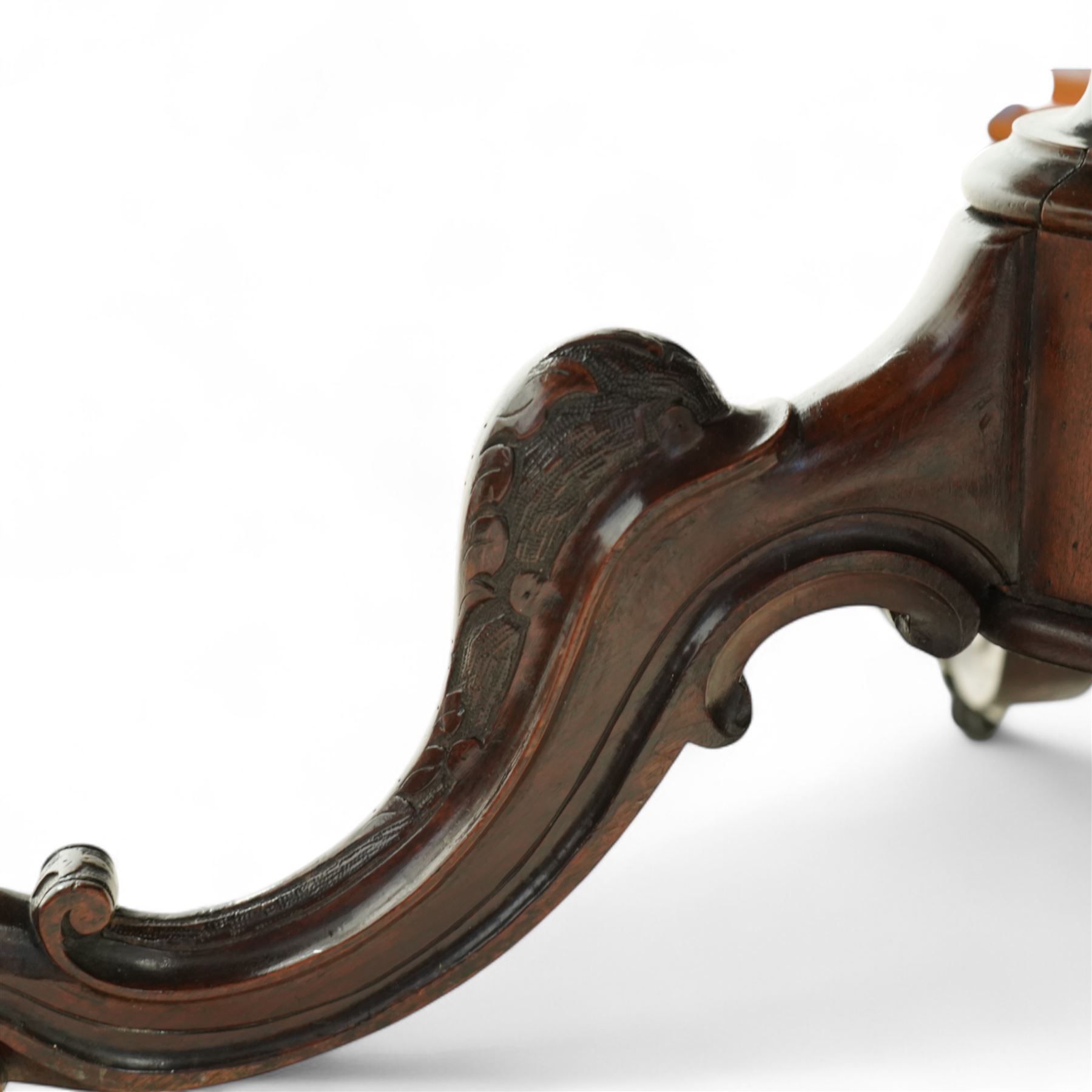 Victorian 19th century burr walnut oval centre table, hinged top above a carved pedestal supported on a scrolled carved quadruped base