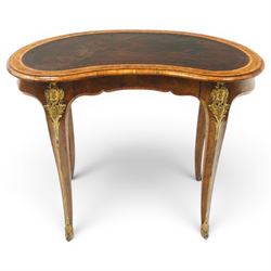Gillow & Company (1862-1897) - Victorian figured walnut kidney shaped writing table, the shaped top inset with oxblood leather writing surface with embossed edge, surrounded by banded burr-walnut and crossbanding with moulded edge, fitted with single shaped frieze drawer flanked by scalloped side-aprons, raised on tapering and chamfered cabriole supports embellished with ormolu mounts in the forms of maidens over tapering acanthus leaves, the mounts trailing down the front of the legs to terminate to ormolu scroll feet, stamped 'Gillow & Co 3576' to drawer interior