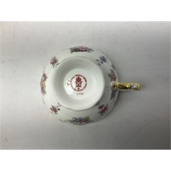 Coalport Revelry pattern tea and dinner wares, comprising nine dinner plates, four salad plates, eleven side plates, sauce boat and stand, ten teacups and ten saucers, and preserve pot and cover, together with a Coalport plate of shaped form decorated with pink roses, and a Royal Crown Derby Royal Antoinette pattern trio