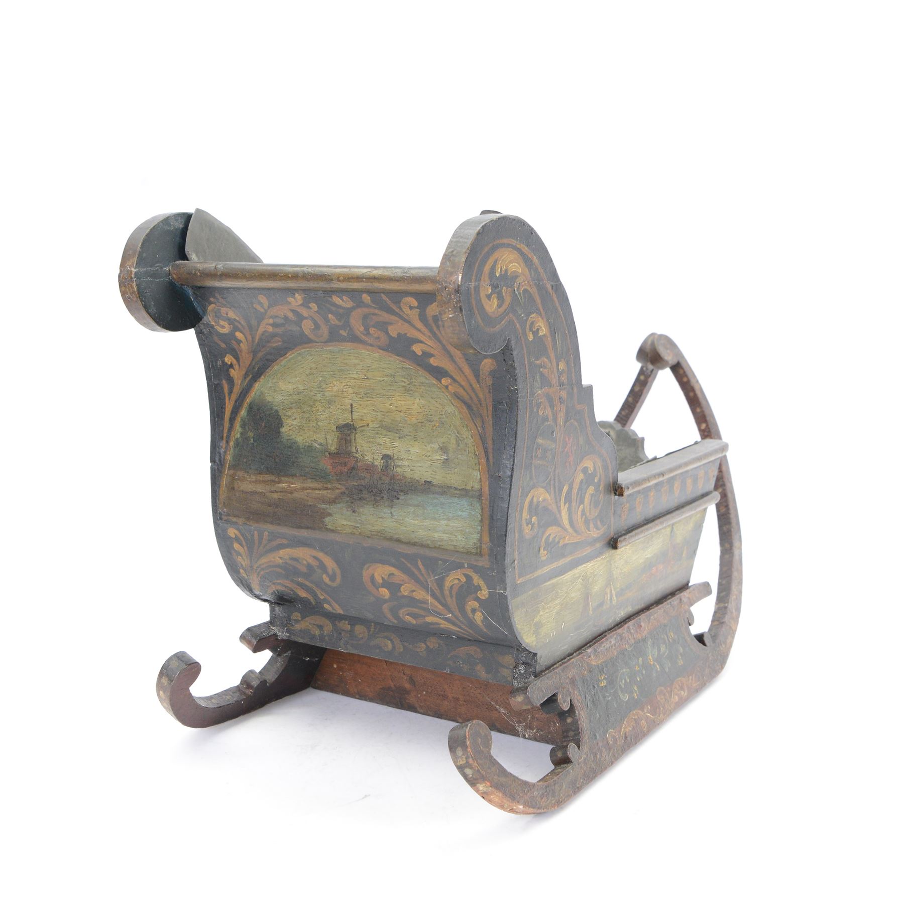Unusual 18th century small Northern European wooden sled, with curved scroll back, the sides painted with coastal shipping scenes, the interior with removable zinc liner, upon curved irons painted with flower heads, H36cm W56cm D29cm