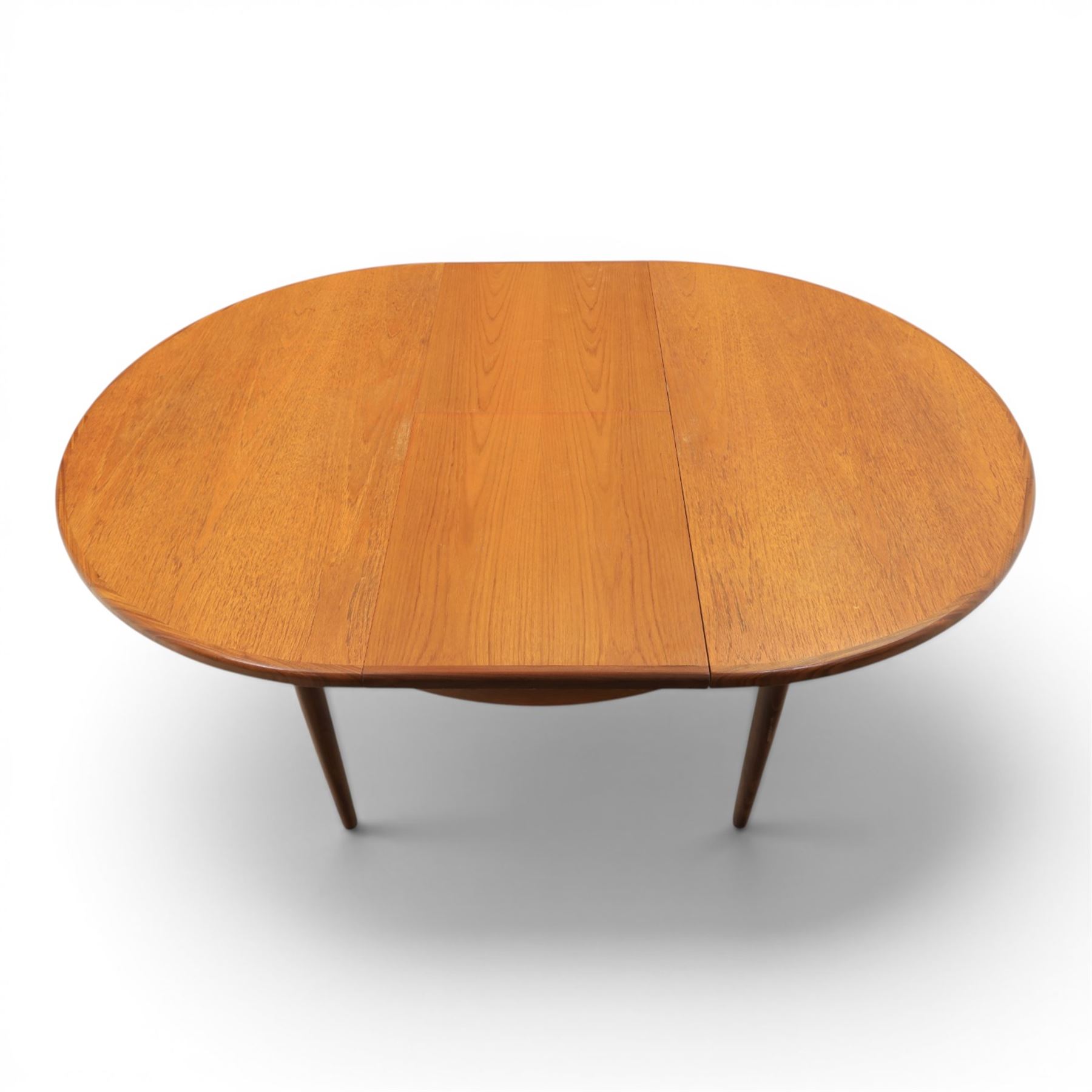 G-Plan - mid-20th century teak 'Fresco' circular extending dining table and six chairs, circular top with storable fold-over leaf extending to 166cm