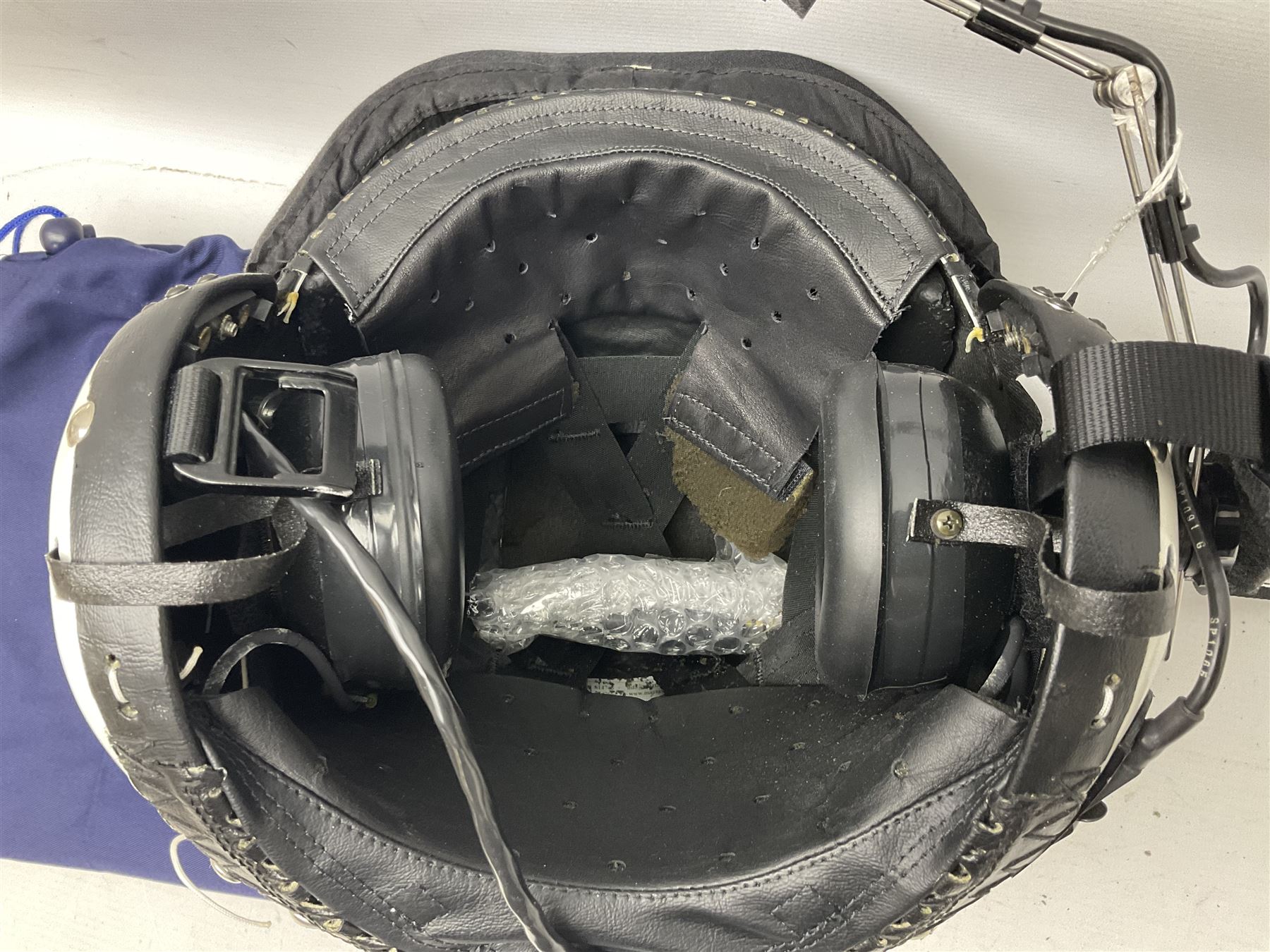 RAF Alpha MK 4 helicopter pilot's flying helmet, finished in white for civilian/rescue service use; reconditioned and avionics tested as working; black cloth cover to visor; fitted with boom microphone; medium size; in blue cloth carrying bag