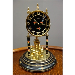  Mid to late 20th century 'Kundo' anniversary torsion clock, black painted with flower head decoration, under glass dome, H30cm  
