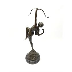 A bronze figure modelled as a female figure with archery bow, upon naturalistic base with foundry mark, and black marble circular base, overall H50cm.