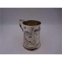 George III silver tankard, of slightly tapering cylindrical from, with chased and repousse crown above a monogrammed cartouche and floral, foliate and C scroll decoration, with acanthus capped C scroll handle, hallmarked WT, possibly William Turton, London 1774, H11.5cm