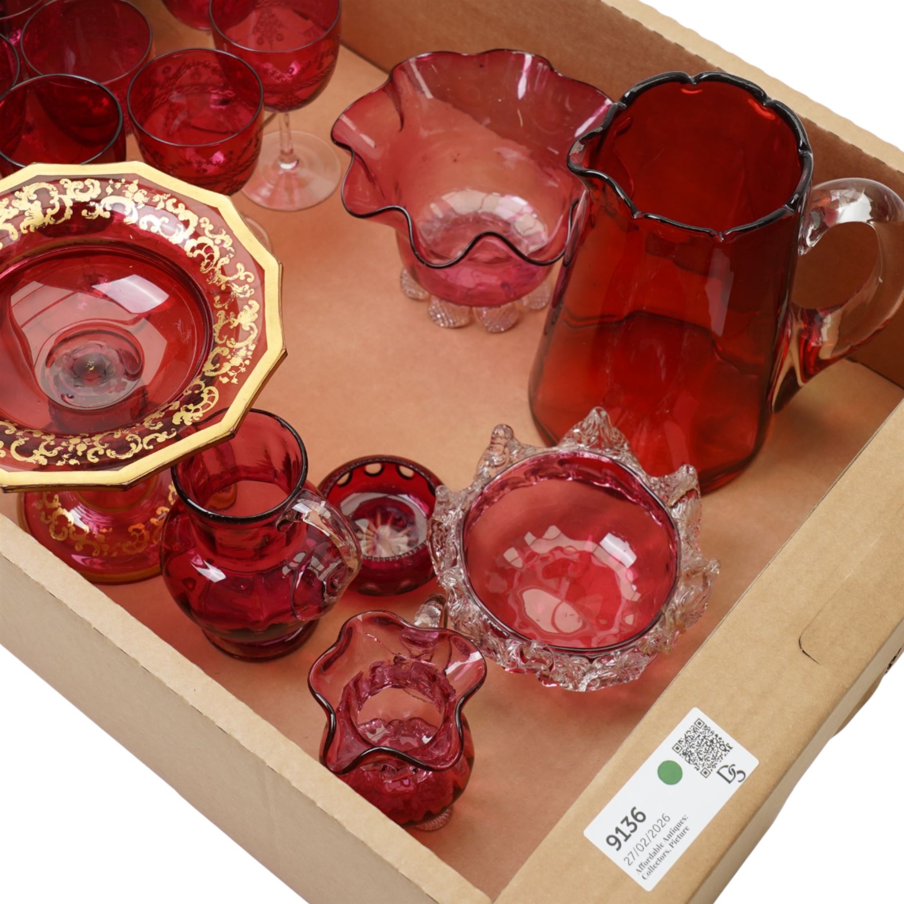 Cranberry glass comport with gilt decoration, various cranberry wine glasses, jug etc