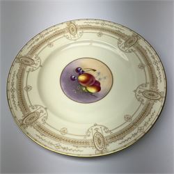 A Royal Worcester cabinet plate, with central hand painted fruit panel to centre depicting cherries and peaches, signed Townsend, upon a pale yellow ground with gilt foliate border to rim, with printed puce mark beneath, D26.5cm.