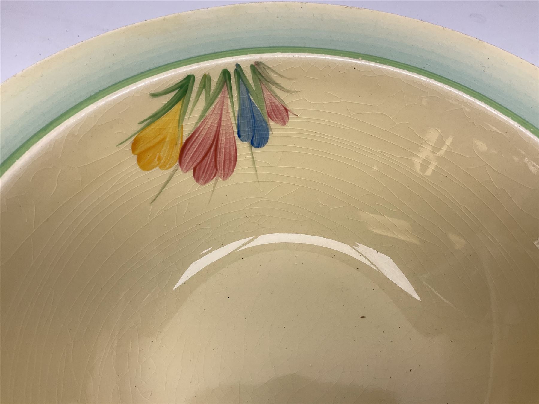 Clarice Cliff twin handled lidded tureen decorated in the Crocus pattern, with printed and impressed marks beneath, W27cm