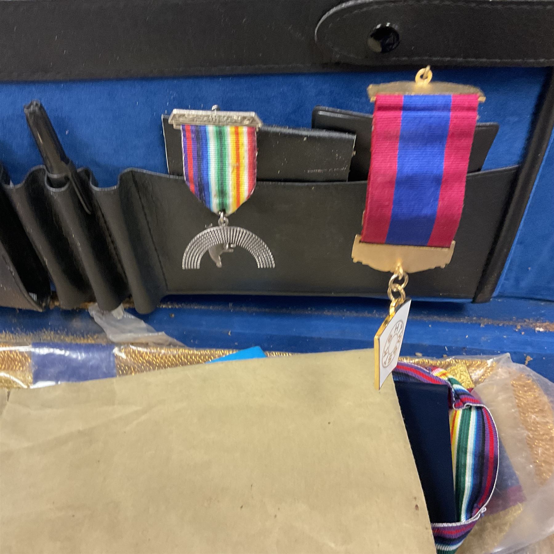 Masonic regalia, including sword, kid leather gloves and apron, Order of Holy Wisdom high priest mitre, etc, contained within briefcases and boxes 
