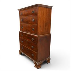 George III mahogany chest on chest, moulded cornice over two short over two long drawers with figured mahogany veneers, lower section fitted with three further long drawers, oval brass plate handles and escutcheons, on shaped bracket feet