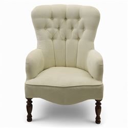 Late 20th century cream upholstered nursing chair, high button-tufted back with shaped wings, scroll arms, loose seat cushion, raised on turned front supports