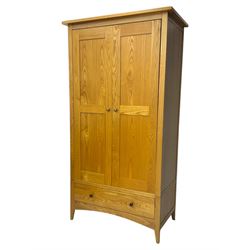 Light oak wardrobe, adjustable clothes rail and single shelf above a single drawer on squared splayed legs