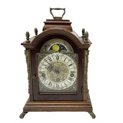 Contemporary - Telma 8-day chiming bracket clock, in a break arch case with carrying handle,  brass dial with a silvered chapter, engraved dial centre ,cast brass spandrels and a working moon dial to the arch, with a three train Hermle  spring driven movement with a floating balance escapement, chiming on 5 gong rods. With key.