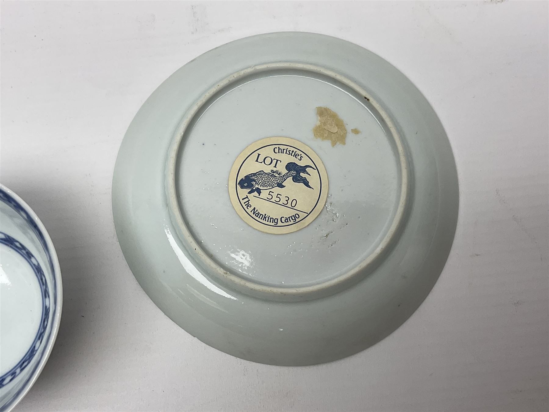 Chinese Nanking Cargo tea bowl and saucer, each decorated with pin tree, saucer with Christie's lot label beneath, tea bowl D7.5cm, saucer D11.5cm