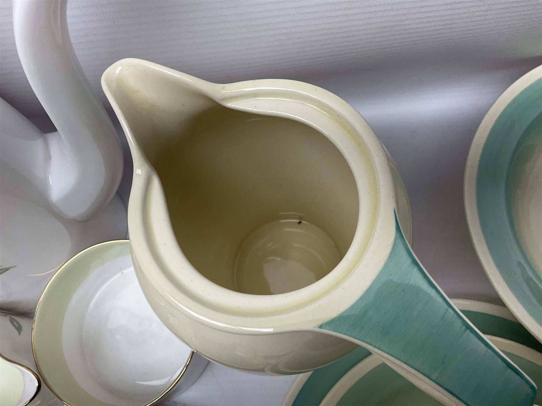 Susie Cooper Dresden Sprays pattern breakfast set, including coffee pot, sugar bowl, milk jug, egg cup, teacup trio and bowl, together with a Susie Cooper Wild Rose pattern coffee service for six