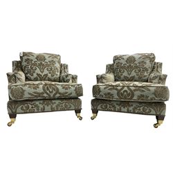 Wade - pair 'Kempston' armchairs, upholstered in chenille fabric with brocade pattern, raised on mahogany finish square tapering block feet with heavy brass castors