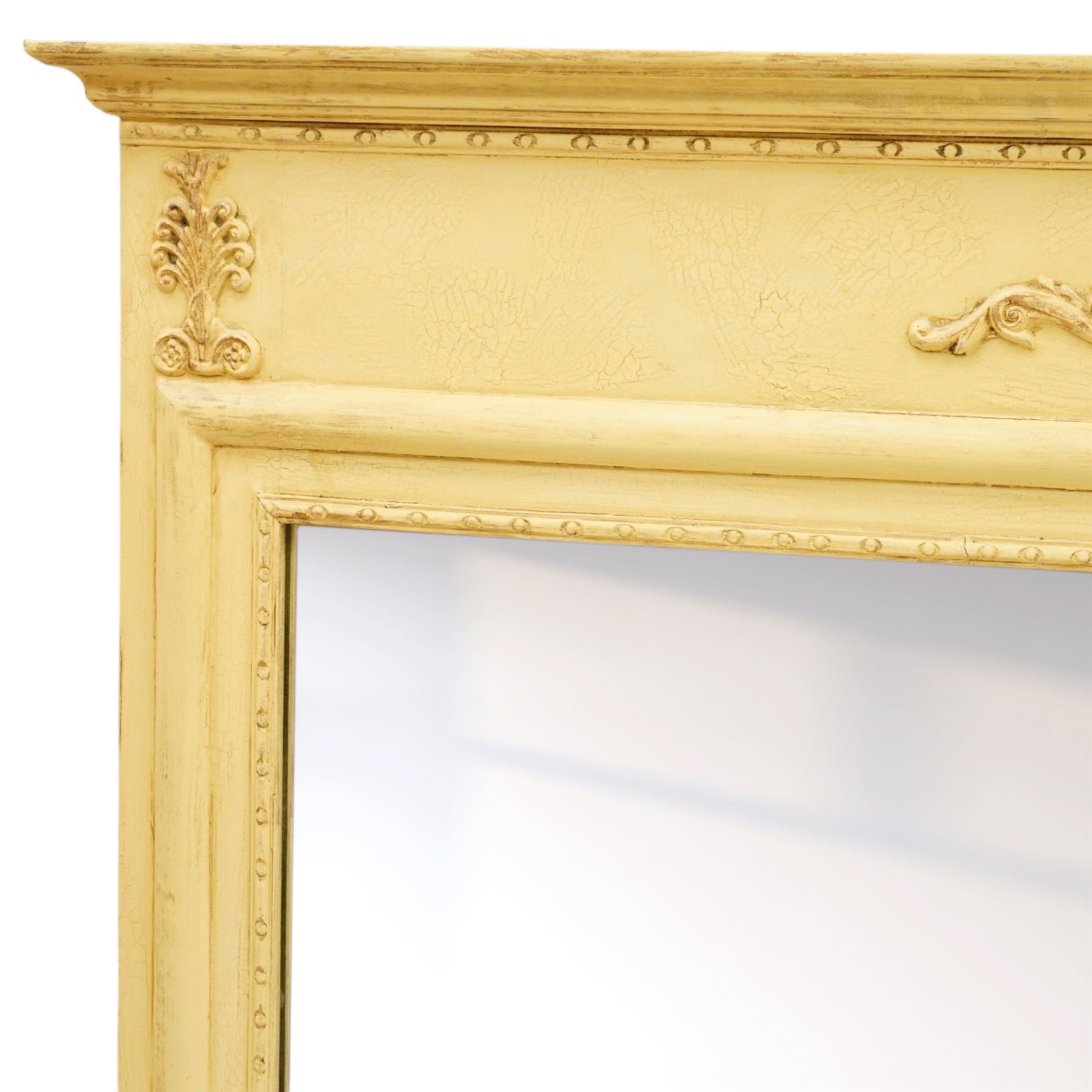 Traditional design cream painted overmantle mirror, projecting cornice with applied foliate detail, bevelled glass plate 