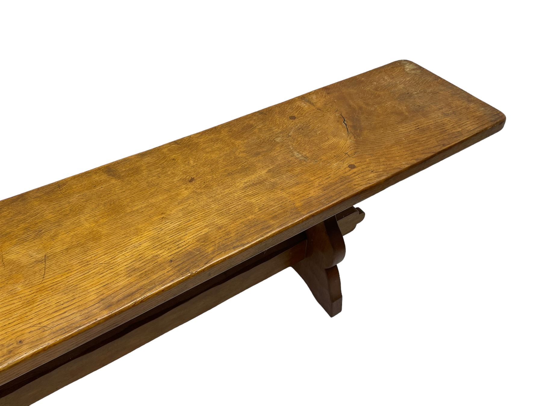 Gnomeman - adzed oak narrow bench, rectangular seat on shaped end supports united by pegged stretcher, carved with gnome signature, by Thomas Whittaker, Little Beck 